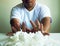 Close up a man holding white tissue for using for cleaning.