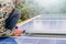 Close up man installing solar panels on a roof house for alternative energy photovoltaic safe energy. power from nature sun power.