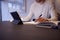 Close Up Of Man In Kitchen Working Or Studying From Home Using Digital Tablet