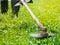 Close up the man mowing the grass. Gardening concept.