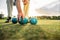 Close up of a man picking a boules standing in a lawn