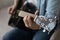 Close up man playing acoustic guitar, artist musician making music