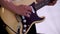 Close Up Of Man Playing Amplified Acoustic Guitar. Clip. Close-up view of hand playing guitar. Musician play on bass