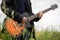 Close up of a man playing guitar