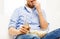 Close up of man with popcorn and beer at home