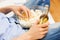 Close up of man with popcorn and beer at home