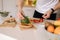 Close-up of man put organic arugula on bruschetta. Vegan food