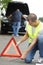 Close up man putting road triangle