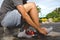 Close-up of man putting on sock before workout