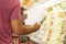 Close Up Of Man Reading Shopping List In Supermarket