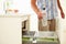 Close Up Of Man Recycling Kitchen Waste In Bin