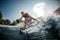 Close-up of man riding down on splashing river wave on foilboard and having fun