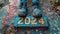 Close-up of man\\\'s feet standing on the road with the number 2024