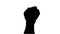 Close-up, man\'s hand clenched into fist, black silhouette on white background. Protest art. A struggle symbol. African