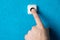 Close-up of man`s hand pressing the button of doorbell