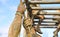 Close-up of man\'s hands climbing the rope