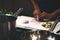 Close up of man`s hands cutting onions on a chopping board