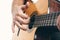 Close up of man`s hands playing acoustic guitar flamenco, taking rasgueado. Music for recreation or hobby concept