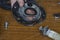 Close-up of a man`s hands showing a torn rubber gasket for a water heater