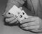 Close-up of man\'s hands shuffling playing cards