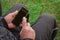 Close up of a man`s wrinkled finger, touching on a cell phone