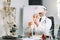 Close up of man scientist wearing vr goggles and holding flask, making test in clinical laboratory. Doctor scientist