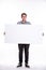 Close up of man showing white board. Guy teenager, student, schoolboy showing empty space white placard