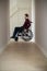 Close Up Of Man Sitting In Wheelchair At Home