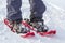 Close-up of man skier feet and legs in short plastic bright prof