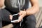 Close up of man with smartphone and earphones wire