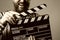 Close-up of a man smiling clapperboard cinema