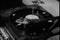 Close-up of man taking needle off record on vintage turntable