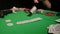 Close-Up of Man Throwing a Poker Chips in slow motion. Close-up of hand with throwing gambling chips on black background