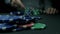 Close-Up of Man Throwing a Poker Chips in slow motion. Close-up of hand with throwing gambling chips on black background