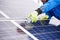 Close-up of man with tools maintaining photovoltaic panels