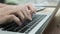 Close-up of man typing on laptop keyboard. Stock footage. Freelancer or businessman works on laptop. Men`s hands print
