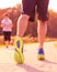 Close up of man walking in nature with jogger in background