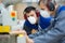 Close-up man wearing mouth mask in factory