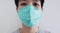 Close-up a man wearing protective face mask. Prevention from Corona virus, bacteria and air pollution dust