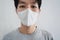 Close-up a man wearing protective face mask. Prevention from Corona virus, bacteria and air pollution dust