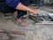 close up, man welding broken chair at his workshop