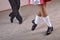 Close-up of a man and woman dancing traditional Irish dances. Legs of dance partners