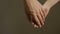 Close up man and woman hand touching holding together on blurred background.