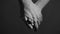 Close up man and woman hand touching holding together on blurred background.