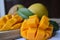Close up of Mangoes on wooden chopping board
