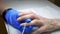 Close up Of Manicurist Hands Removing Cuticle From Female Nails With Professional Metal Nail Scissors. Woman Hand With Healthy