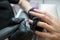 Close-up of a manicurist removing varnish from a client`s nails using a router