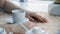 Close up mans hands with cup of coffee on the table and window background. Businessman coffee break closeup, hands with