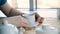 Close up mans hands with cup of coffee on the table and window background. Businessman coffee break closeup, hands with