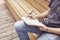 Close-up of mans hands writing in a note book sitting outside. Concept of education students youth